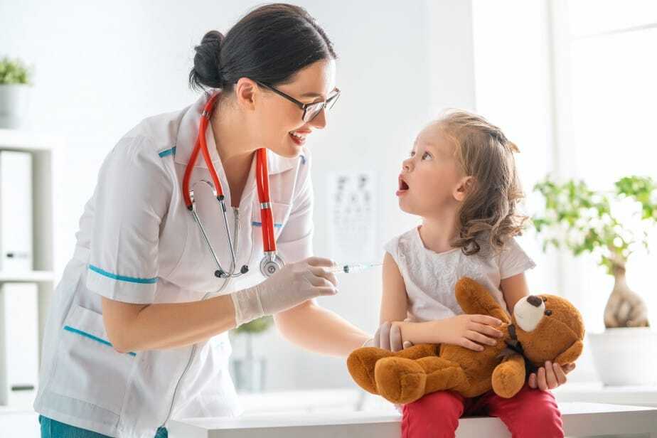 Happy kid getting a vaccine